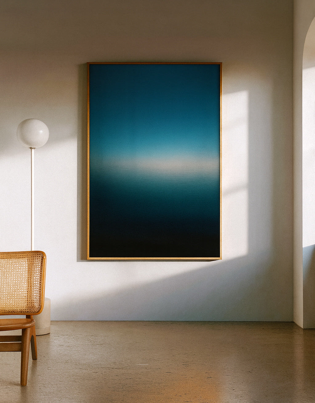 Large abstract painting on a wall in a minimalistic room with a chair and lamp.